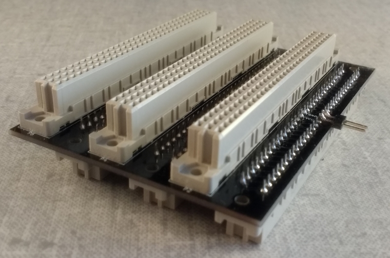 Little black PCB with 3 DIN-41612 connectors on each side